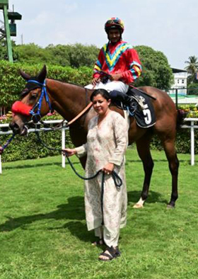Golden Peaks (Akshay Kumar up) winner of the Beautiful Babe Plate (Div II), being led in by trainer Parvati Byramji on Sunday racecs at Bangalore.